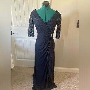 Betsy and Adam size 10 formal dress in Navy blue with rhinestone accessory.